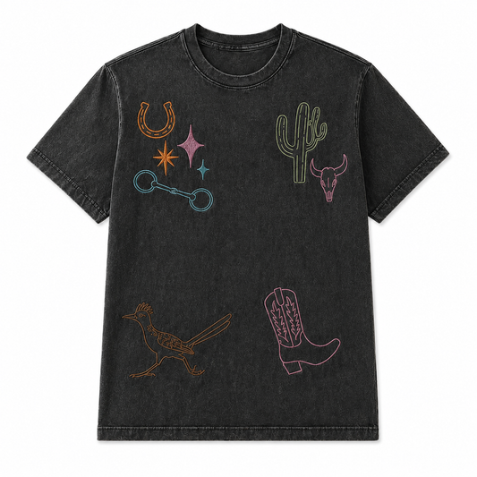 Black vintage wash t-shirt with colorful embroidered designs on a white background