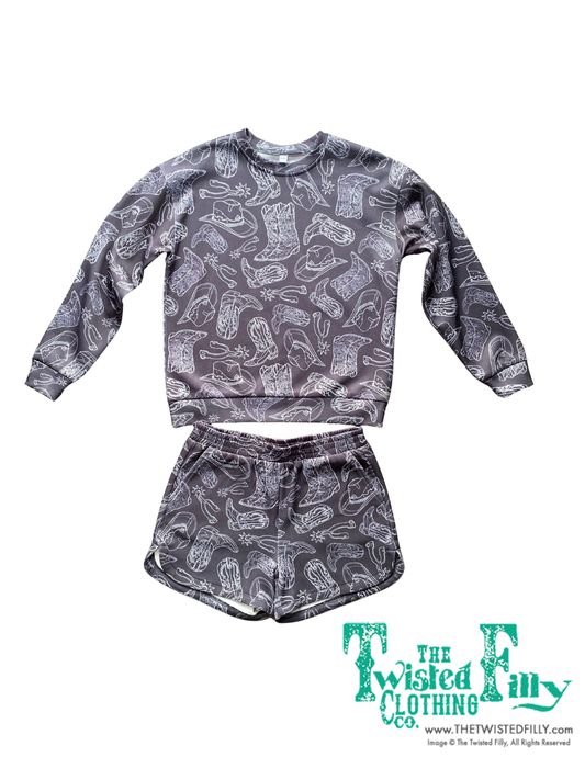 Black sweatshirt and shorts set with cowboy boot pattern on a white background, branded 'The Twisted Filly'.